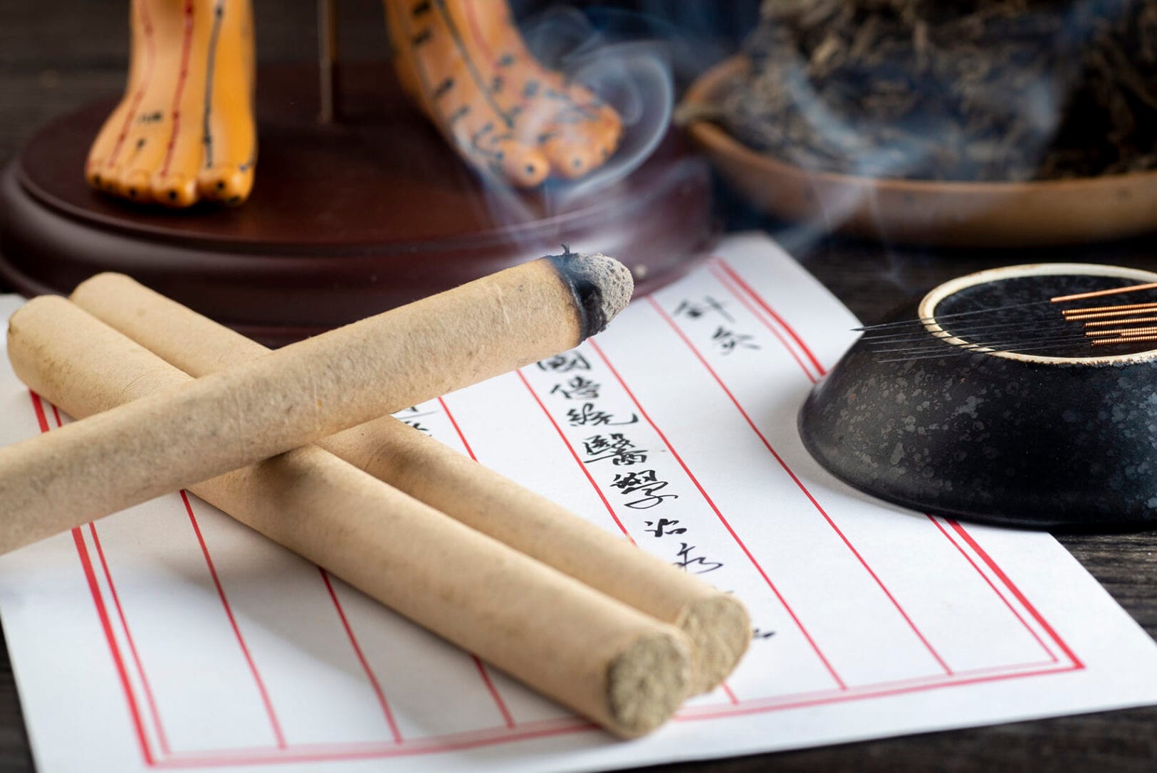 Traditional moxibustion practice showing authentic mugwort application